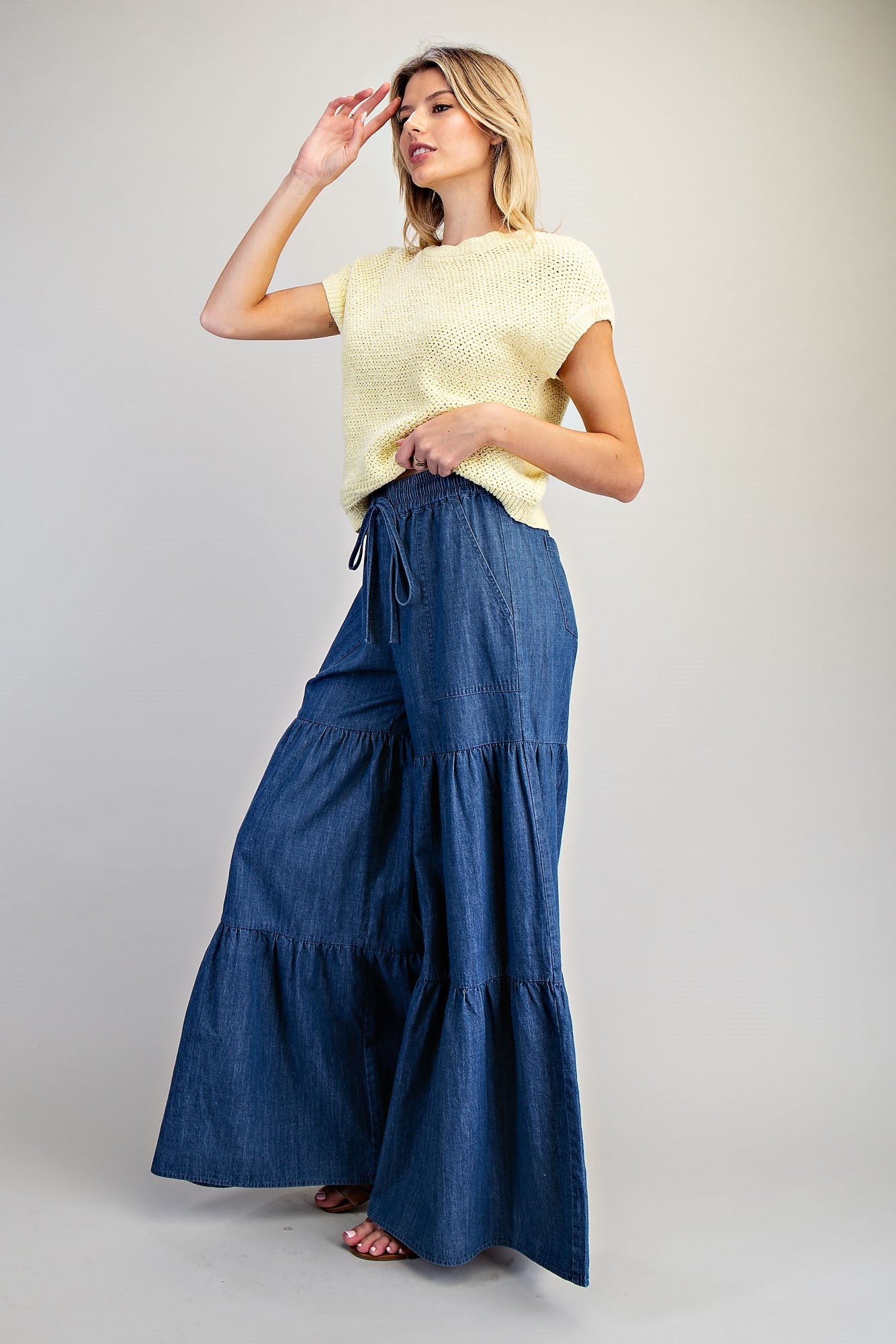 RARA Boutique mineral washed denim palazzo pants with a tiered ultra-wide leg design, relaxed fit, and stylish casual look.