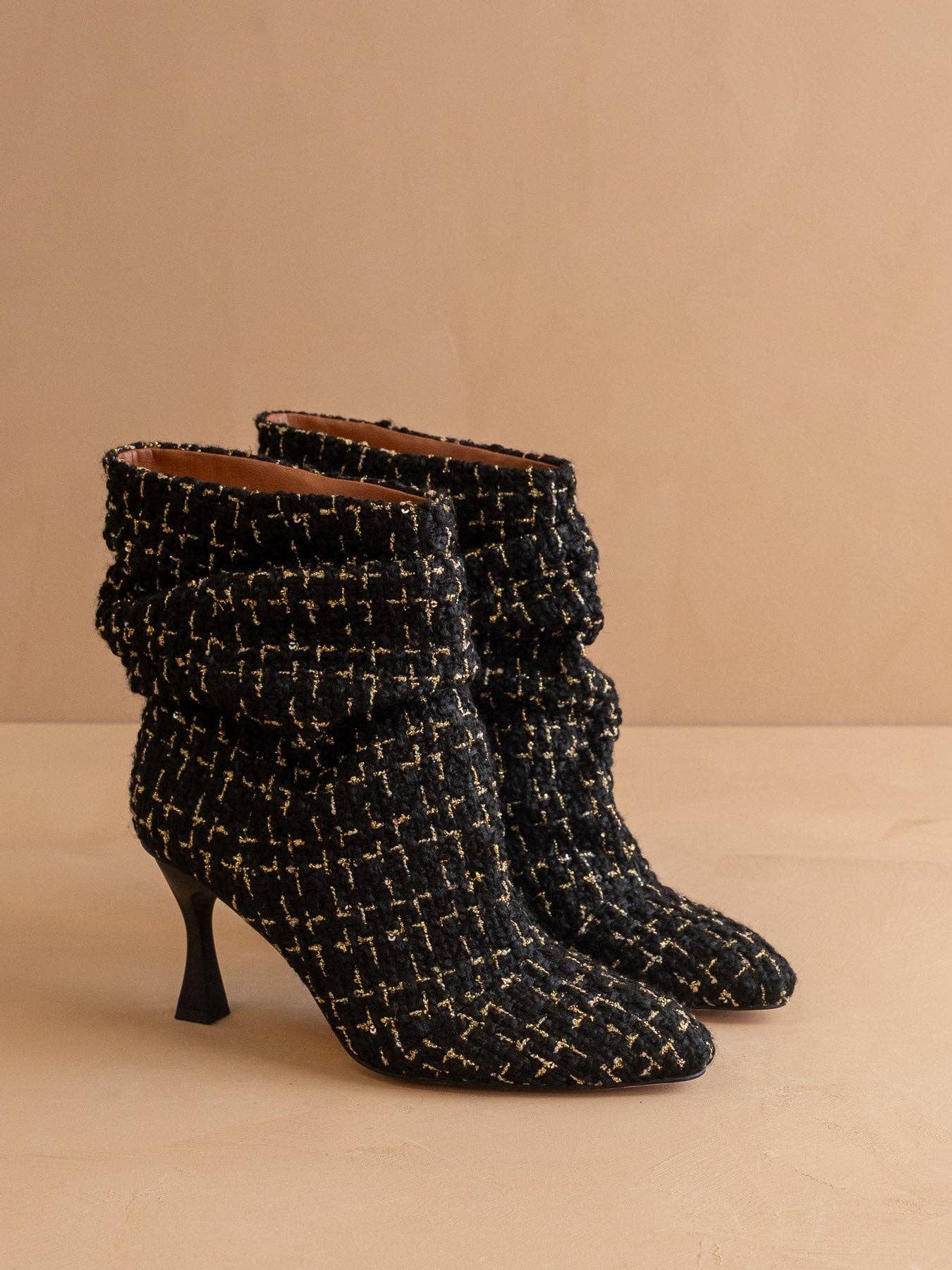 Black tweed slouch heel fall bootie with pointed toe and chunky heel by Oasis Society, featuring a stylish, textured design.