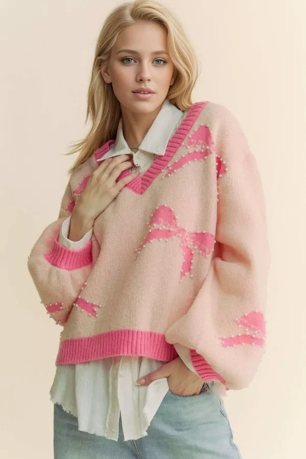 RARA Boutique pearl studded bow balloon sleeve V-neck sweater, stylish knit with decorative pearl accents and a relaxed fit.