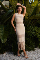 RARA Boutique Cowrie Shell Open Knit Fringe Maxi Dress featuring a flowing open knit design with fringe accents