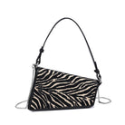 Urban Expressions Tuesday Fatima zebra shoulder bag with adjustable strap and black accents, featuring a textured zebra print design.