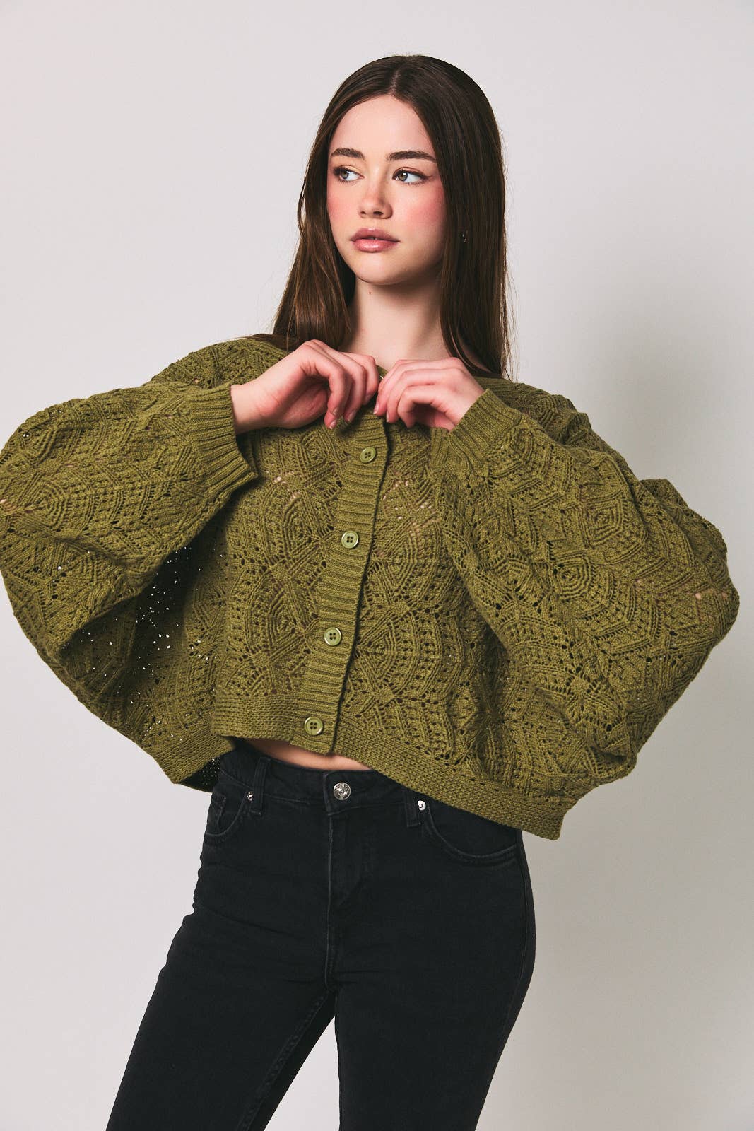 Le Lis long sleeve crochet cardigan in soft, intricate knit with a relaxed fit, displayed on a neutral background.