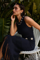 Navy cowrie shell open knit fringe maxi dress by RARA Boutique with flowing silhouette and intricate shell details.