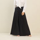 Wide-leg cotton trouser from RARA Boutique featuring pleated design and ultra-wide fit, styled as a fashionable ultra-wide leg pant.