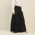 Light beige pleated ultra-wide leg cotton trousers by RARA Boutique, featuring a relaxed fit and flowing silhouette.