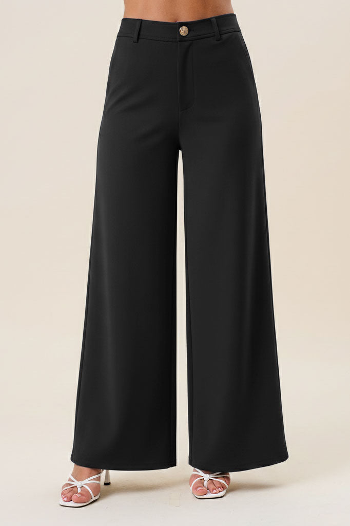 Black high waist tailored wide-leg trousers from RARA Boutique, showcasing a sleek, structured fit with a smooth fabric finish.