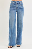 Medium shot of Risen studded wide-leg high-rise jeans from RARA Boutique, showcasing their stylish fit and distressed details.