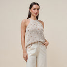 Seashell embellished open knit halter tank top by RARA Boutique, featuring a stylish design with shell details on the fabric.