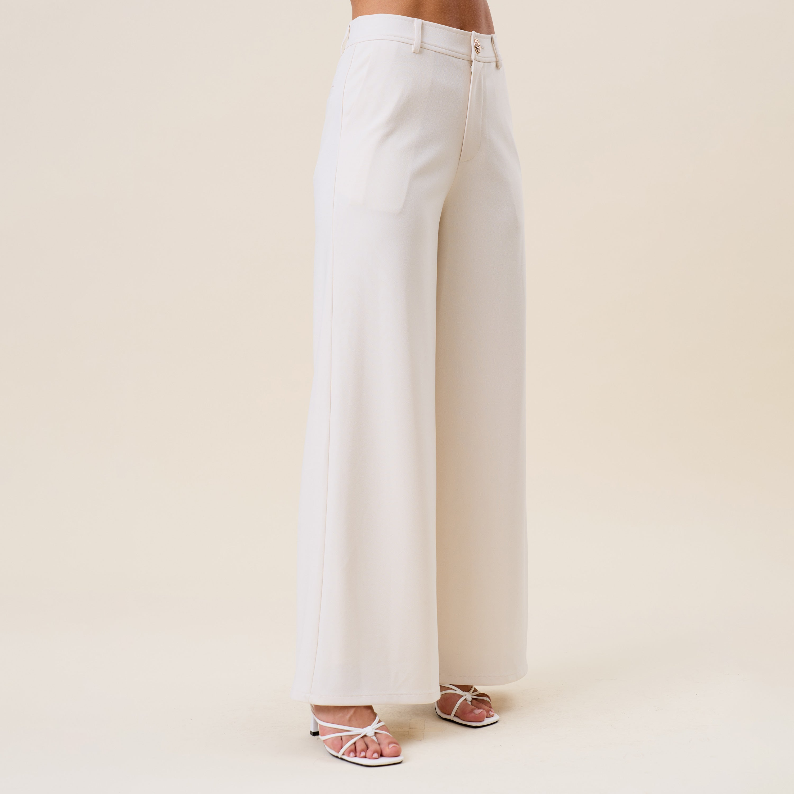High waist tailored wide-leg trousers by RARA Boutique, showing the fit and fabric details of these stylish women's trousers.
