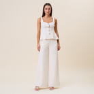 High waist tailored wide leg trousers by RARA Boutique, showcasing the sleek fit and elegant design in a neutral fabric.
