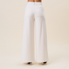 High waist tailored wide-leg trousers by RARA Boutique, featuring a sophisticated fit and classic design in neutral fabric.