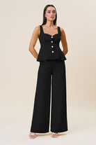 Black high waist tailored wide-leg trousers by RARA Boutique, shown flat with front view and smooth fabric.