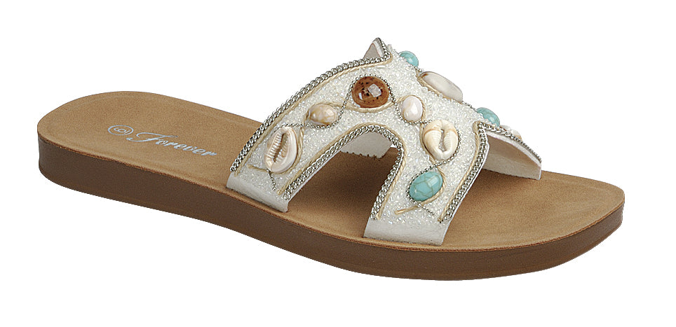 White boho H-strap slide sandals with seashell and beaded details from RARA Boutique, featuring a stylish and comfortable sandal design.