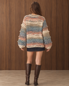 Multicolor textured knit cardigan sweater by RARA Boutique with fringe details, button-down front, shown from the back view.