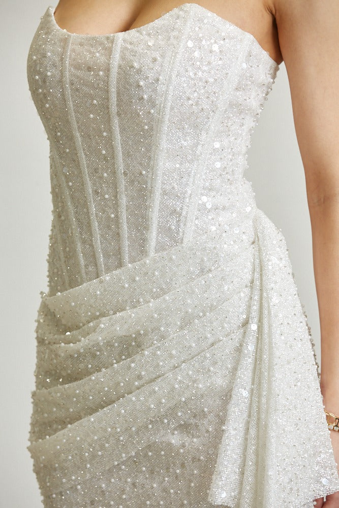 Strapless sequin glitter mesh corset mini dress with draped skirt by RARA Boutique, featuring shiny sequins and a fitted silhouette.