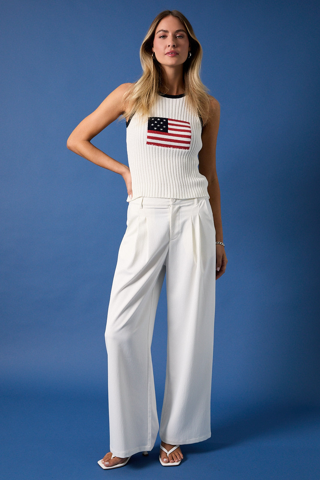 White and navy American flag sleeveless knit tank top by RARA Boutique, featuring patriotic star and stripe design.