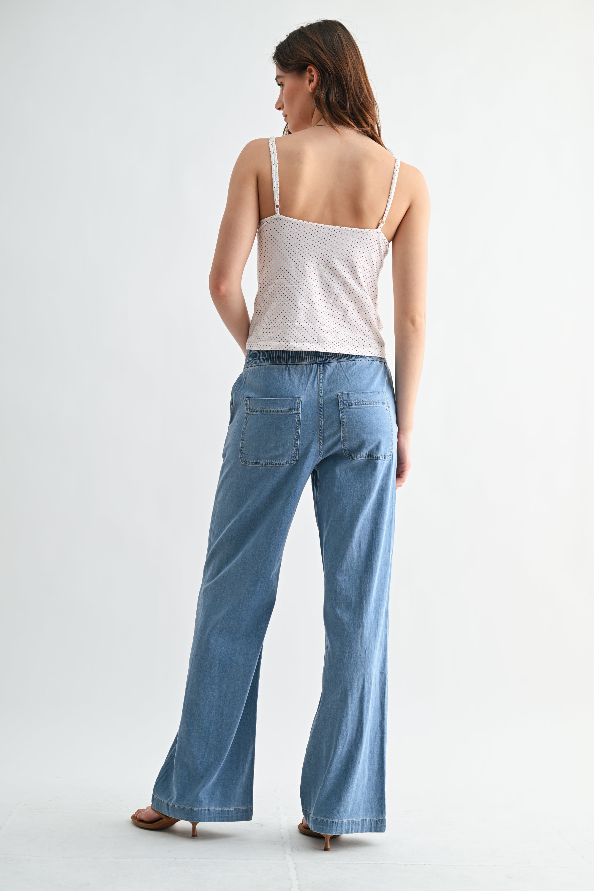 Lightweight denim jogger pants with elastic waist from RARA Boutique, showing relaxed fit and casual style.