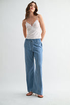 Lightweight denim jogger pants with elastic waist from RARA Boutique, showing relaxed fit and casual style in a natural pose.