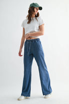Lightweight denim jogger pants with elastic waist from RARA Boutique, featuring a relaxed fit and casual style.