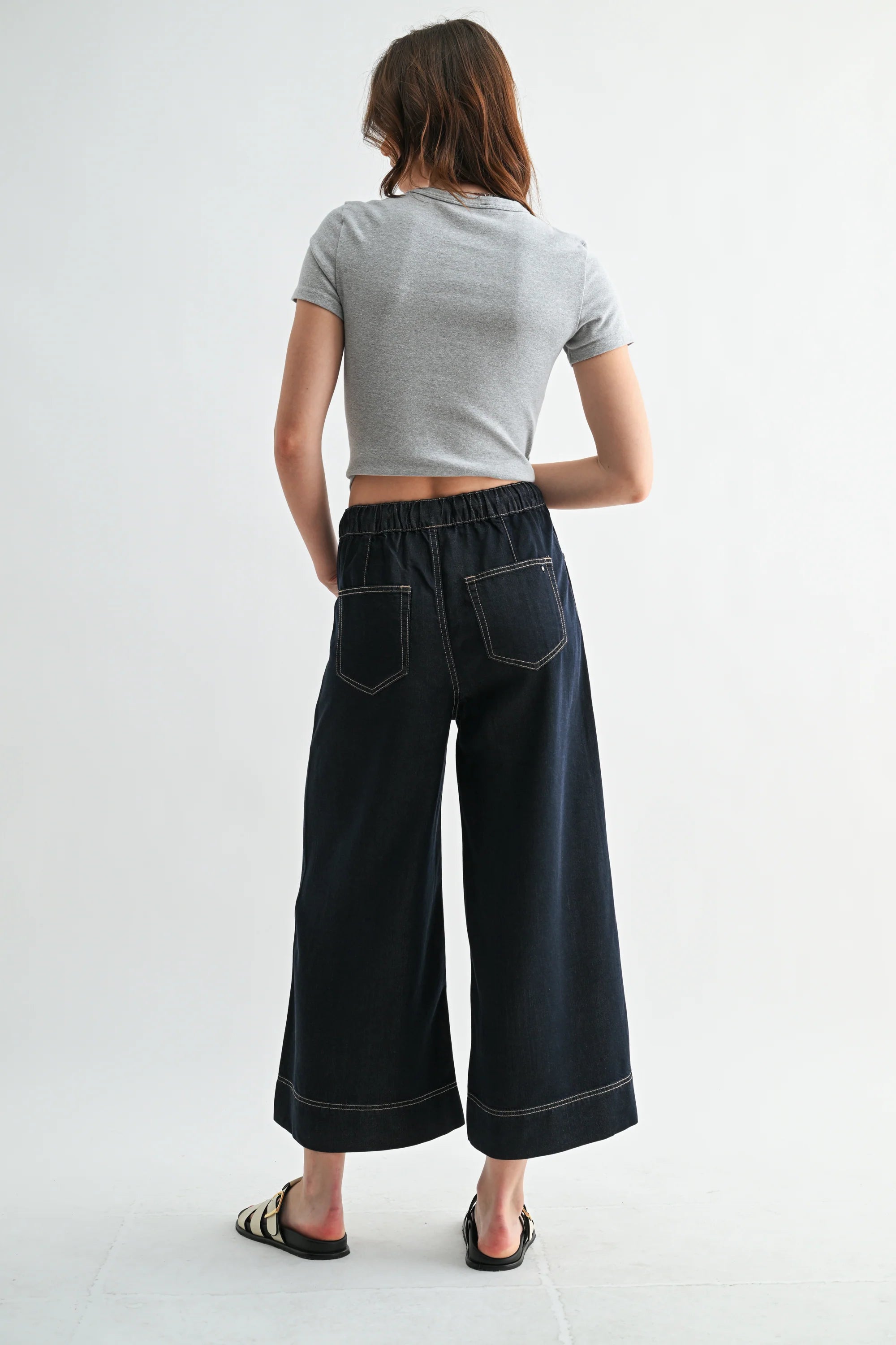 Wide leg high-rise cropped denim-look jogger pants by RARA Boutique, featuring a relaxed fit and stylish denim texture.