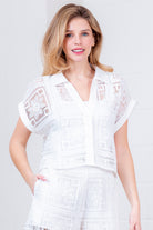 Floral crochet button-down collared blouse by RARA Boutique featuring intricate floral patterns and a classic collar design.