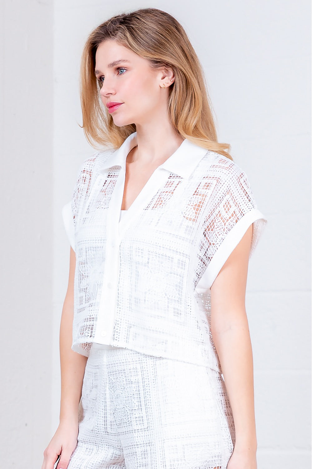 RARA Boutique floral crochet button-down collared blouse with intricate floral patterns and lightweight fabric.