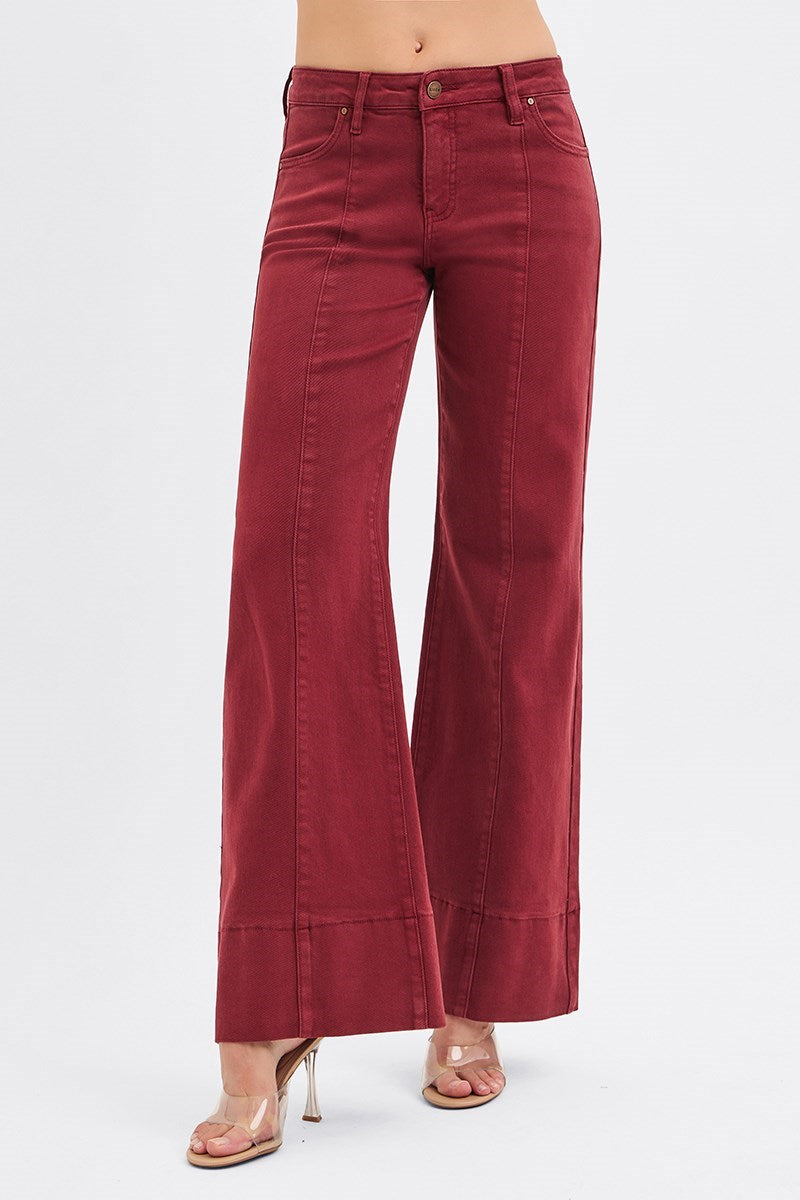 Risen Tummy Control Mid Rise Pin Tuck Wide Leg Jeans with Wide Hem in wine color, showcasing the relaxed fit and stylish design.