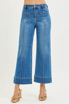 Risen pintuck square patch pocket wide-leg cropped jeans in medium wash with relaxed fit and stylish design.