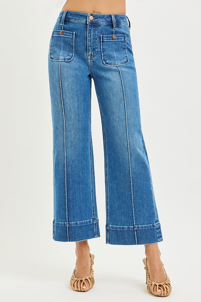 Medium wash Risen Pintuck Square Patch Pocket Wide Leg Cropped Jeans showing front view with patch pockets and wide-leg style.