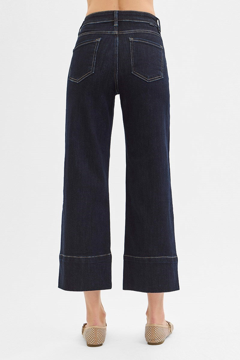 Dark wash pintuck tummy control wide-leg cropped jeans with wide hem from RARA Boutique, showcasing a relaxed fit and stylish design.