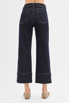 Dark wash pintuck tummy control wide-leg cropped jeans with wide hem from RARA Boutique, showcasing a relaxed fit and stylish design.