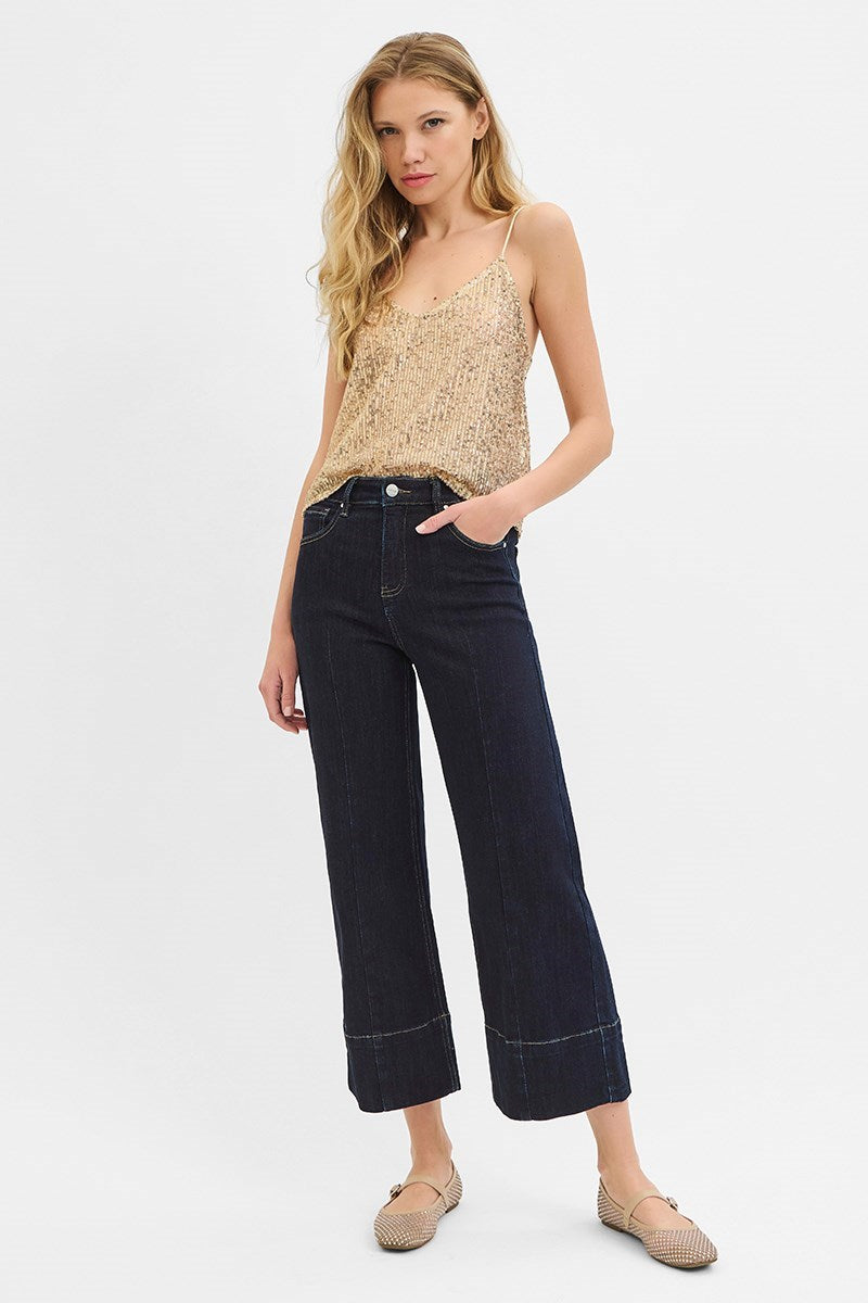 Dark wash Pintuck Tummy Control wide leg cropped jeans with wide hem from RARA Boutique, featuring a high-rise fit and relaxed style.