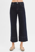 Dark wash pintuck tummy control wide-leg cropped jeans with wide hem by Risen, featuring a stylish and flattering fit.