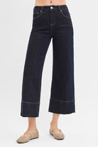 Dark rinse Pintuck Tummy Control Wide Leg Cropped Jeans with wide hem from Risen, showcasing a relaxed fit and stylish design.