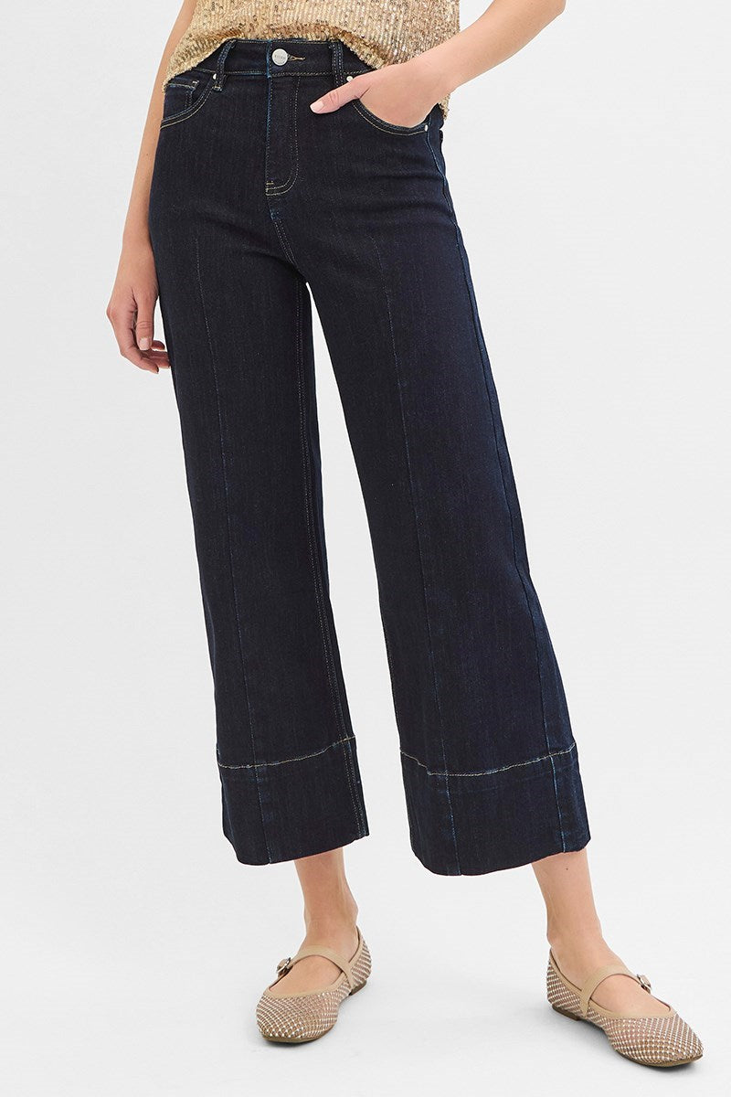 Dark wash Pintuck Tummy Control wide-leg cropped jeans with wide hem from RARA Boutique, showcasing a relaxed fit and stylish design.