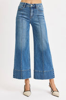 Medium Risen Pintuck Tummy Control Wide Leg Cropped Jeans with Wide Hem, showcasing a stylish fit and relaxed denim design.