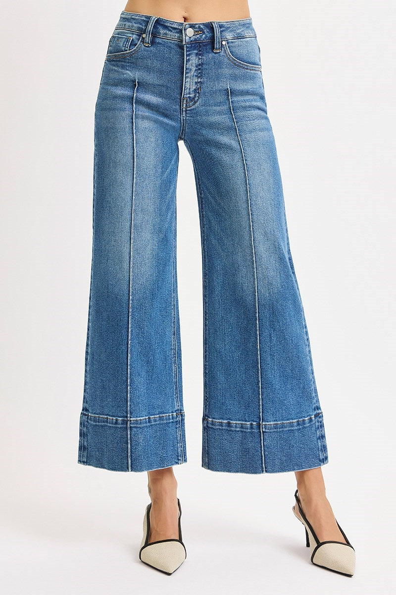 Medium Risen Pintuck Tummy Control Wide Leg Cropped Jeans with Wide Hem, showcasing a stylish fit and relaxed denim design.