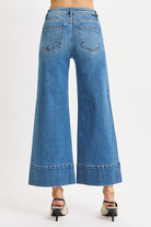Risen Pintuck Tummy Control wide-leg cropped jeans with wide hem, featuring a stylish and comfortable denim design.