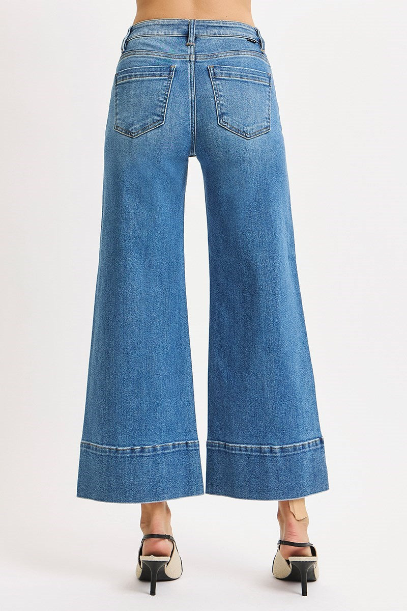 Risen Pintuck Tummy Control wide-leg cropped jeans with wide hem, featuring a stylish and comfortable denim design.
