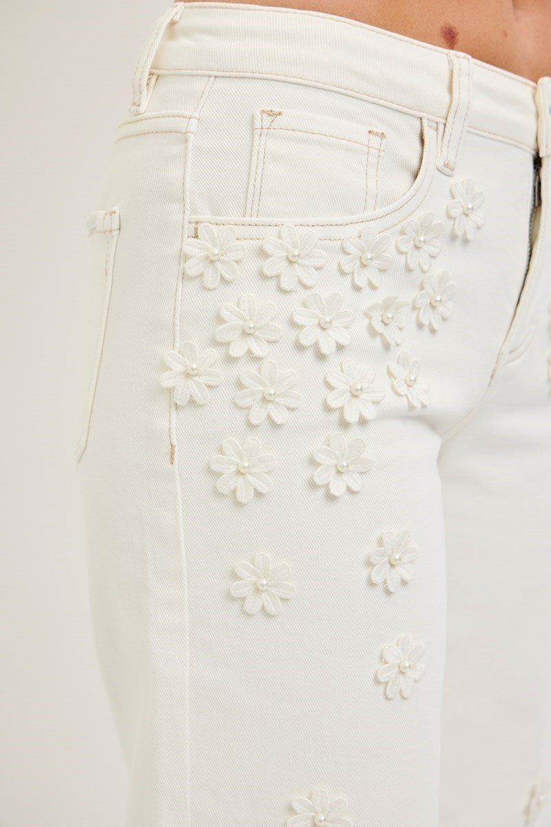 Cream wide-leg cropped jeans with 3D flower and pearl embellishments by Risen, featuring a stylish, relaxed fit and trendy design.