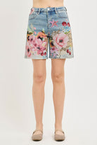 Artsy floral collage print wide-leg denim shorts by Risen, featuring a relaxed fit and stylish design from RARA Boutique.