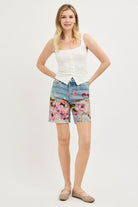 Artsy floral collage print wide-leg denim shorts by Risen, featuring a relaxed fit and stylish design for casual wear.