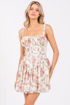 Ivory pink floral corset drop-waist A-line mini dress by RARA Boutique, featuring a fitted bodice and flowy skirt.