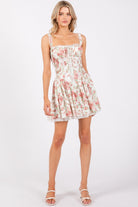 Ivory pink floral corset drop-waist A-line mini dress by RARA Boutique, featuring a fitted bodice and flowy skirt.