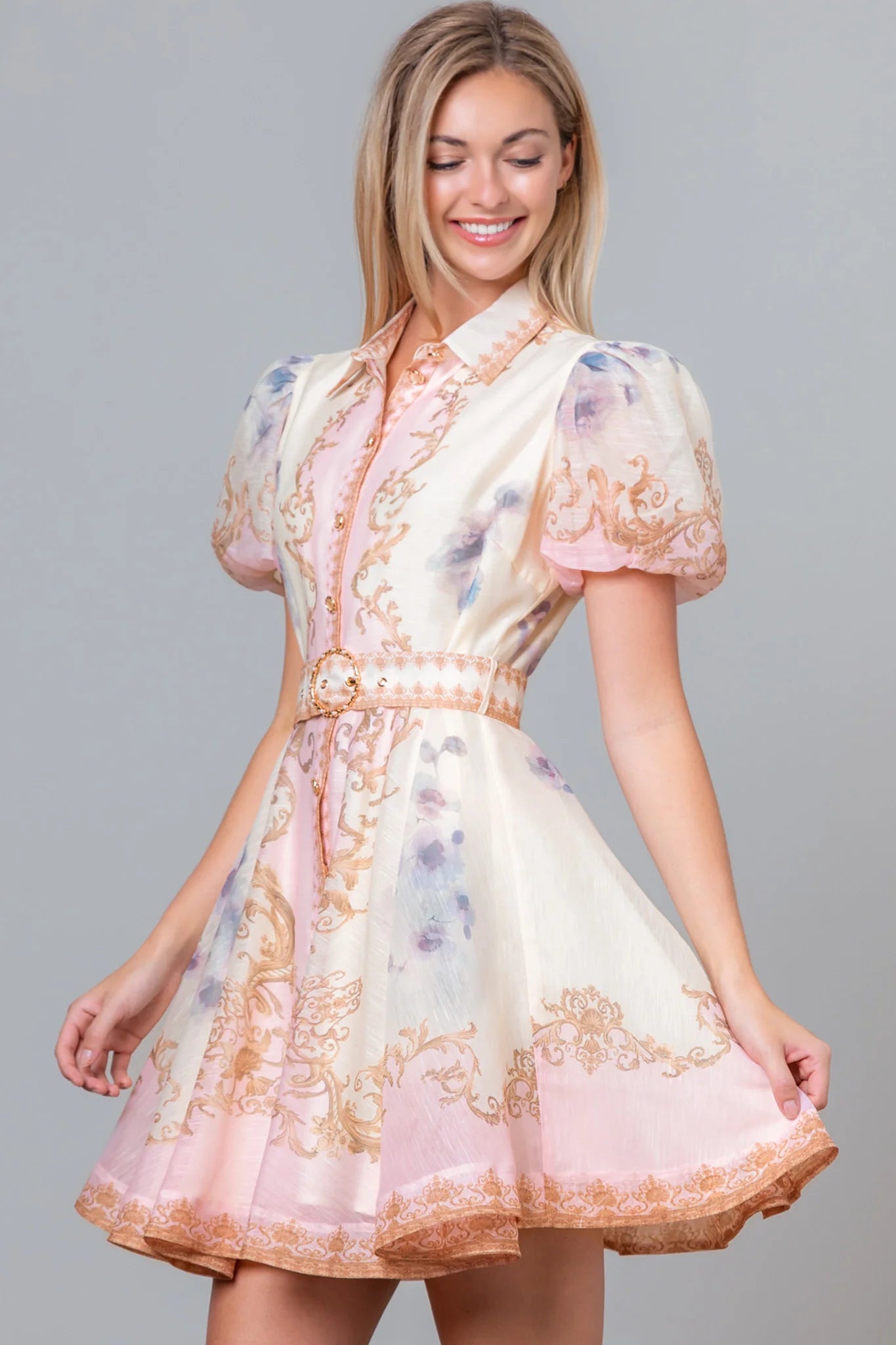 RARA Boutique Baroque scrollwork floral mini dress in baby pink with pearl belt, showcasing intricate design and elegant style.
