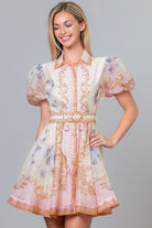Pink Baroque scrollwork floral mini dress with pearl belt from RARA Boutique, showcasing intricate patterns and elegant design.