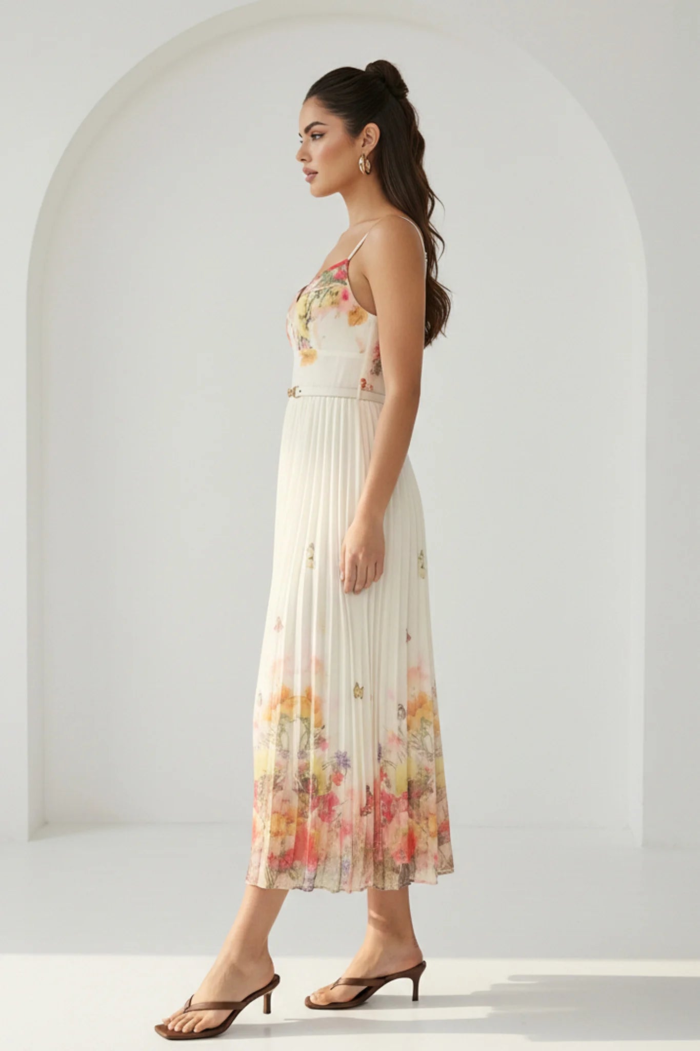 Watercolor floral butterfly pleated midi dress with belt in peach by RARA Boutique, featuring a flowy, feminine design.