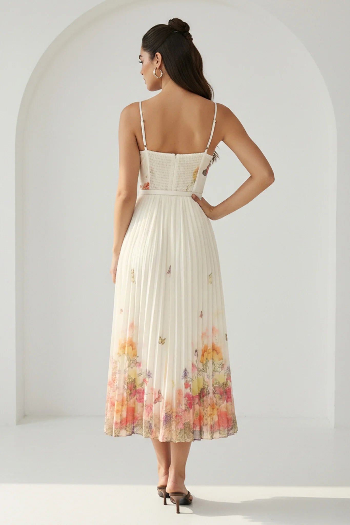RARA Boutique watercolor floral butterfly pleated midi dress with belt in peach, featuring a flowing design and elegant style.
