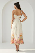 RARA Boutique watercolor floral butterfly pleated midi dress with belt in peach, featuring a flowing design and elegant style.