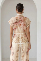 Peach watercolor floral baroque border blouse with button-down front and matching belt from RARA Boutique.